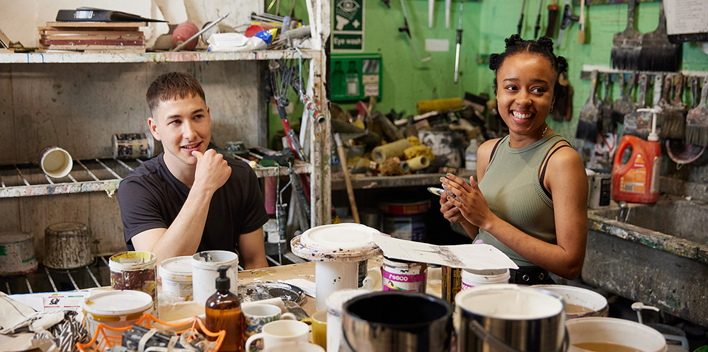 2 art students in their studio workshop