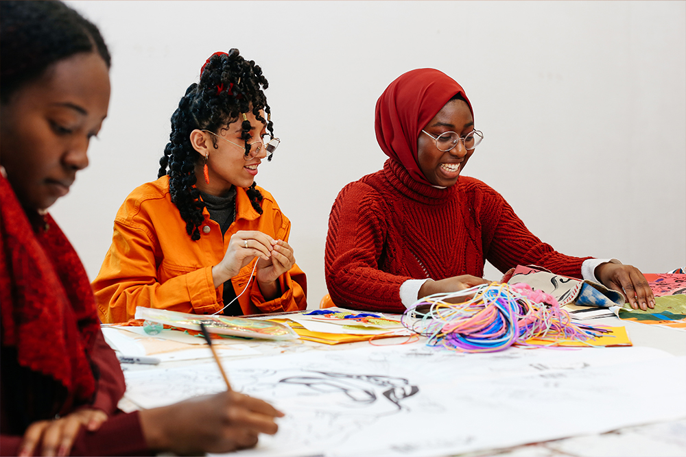 Angelica Ellis (left) BA (Hons) Fashion Textiles_ Print, and Ashaana Bheir (orange top), Memunatu Barrie (red knit jumper) both BA (Hons) Textile Design